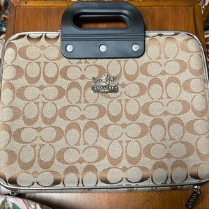 Coach laptop case, hard case. This case is not padded it is a hard case.